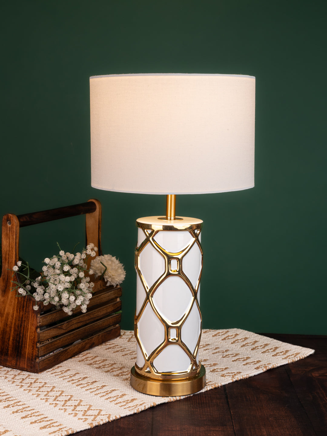Table lamp / bedside lamp with a exotic combination of snow white and gold