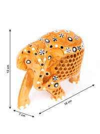 Kadam wood carved Jali Design Elephant figurine with a sad face - The Heritage Artifacts
