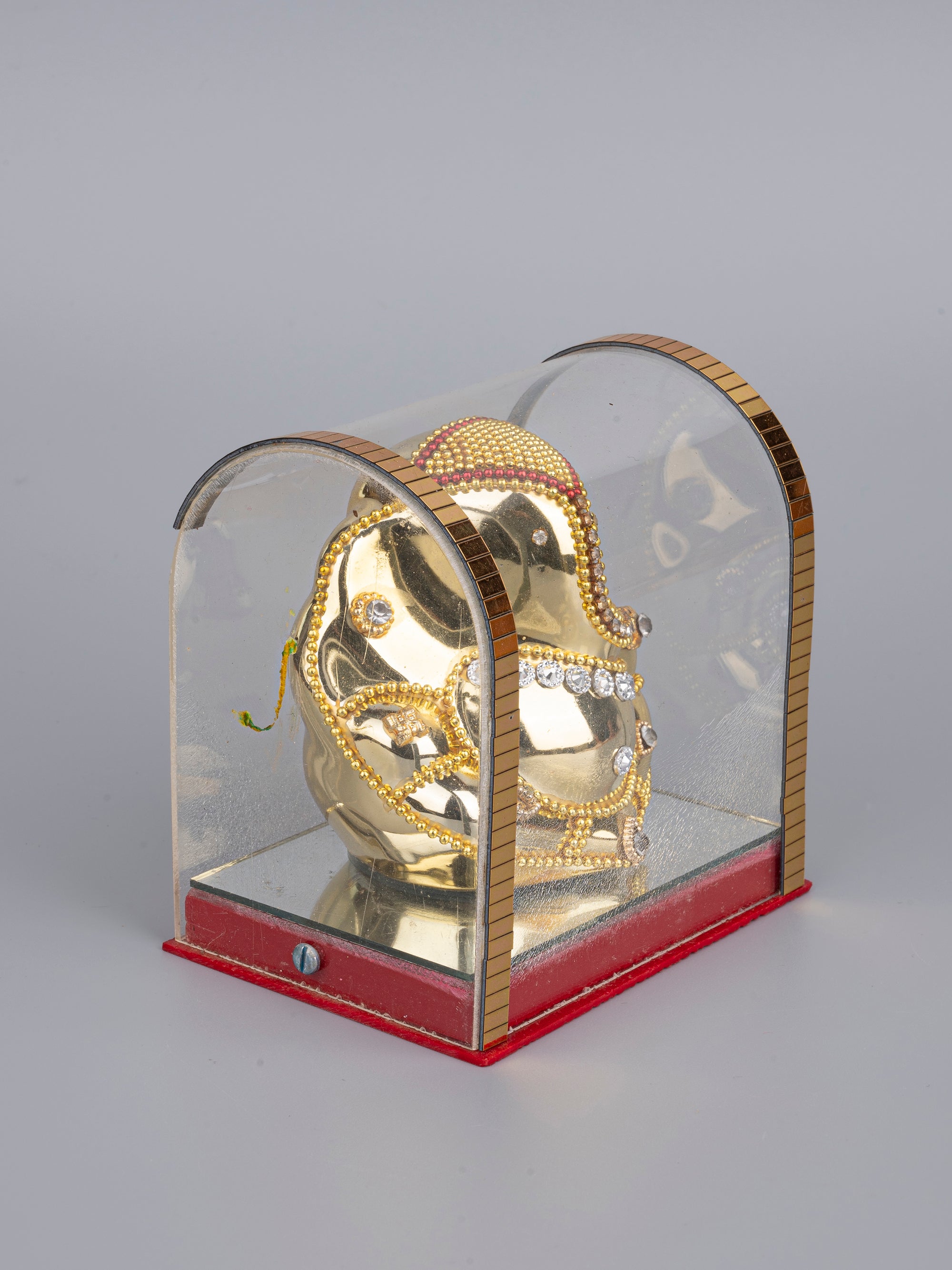 Small Sitting Ganesh Statue in Golden color inside an Acrylic Box - The Heritage Artifacts
