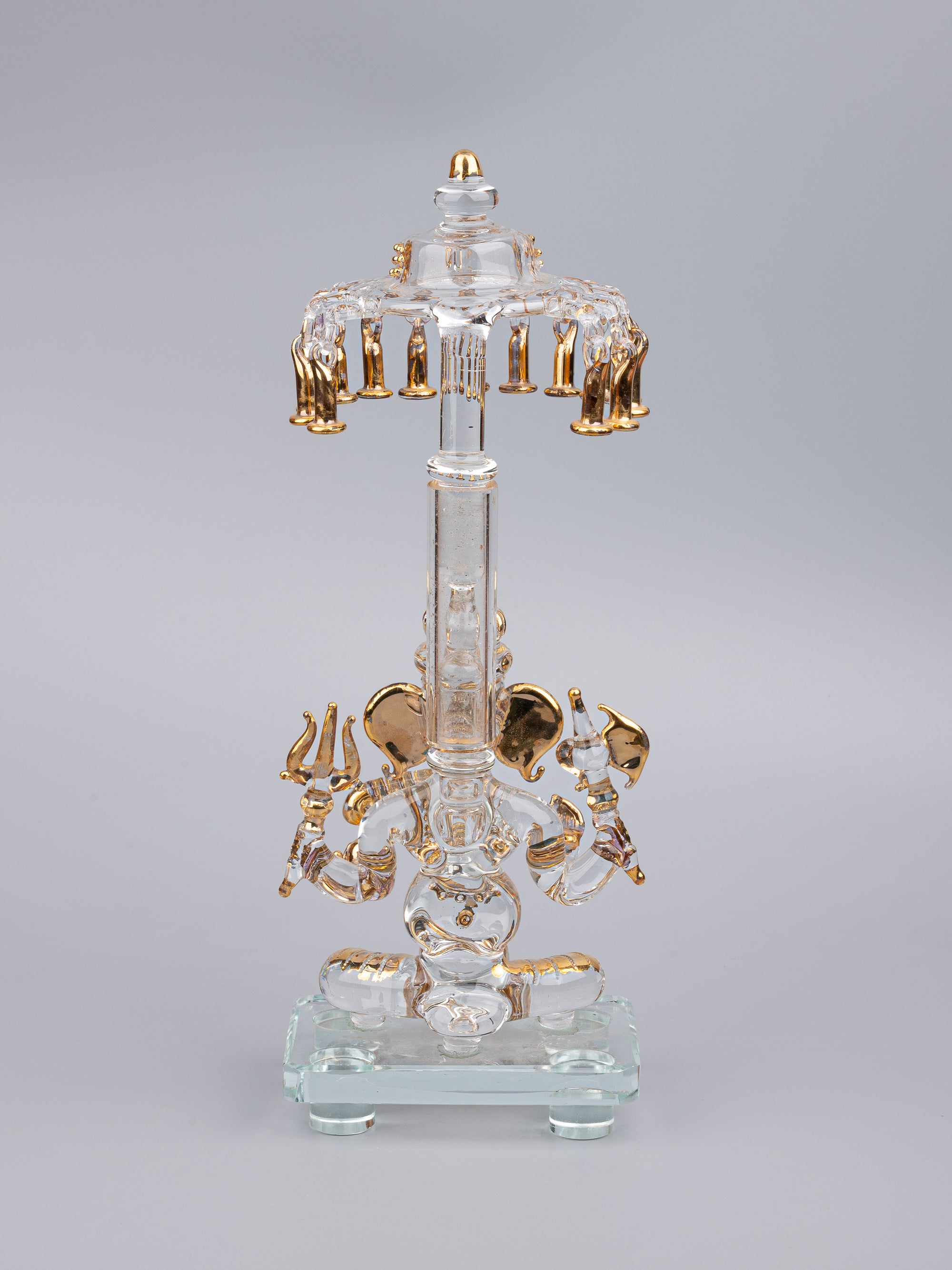 Glass statue of Lord Ganesh sitting below Umbrella - 10 inches height with Gold plating - The Heritage Artifacts