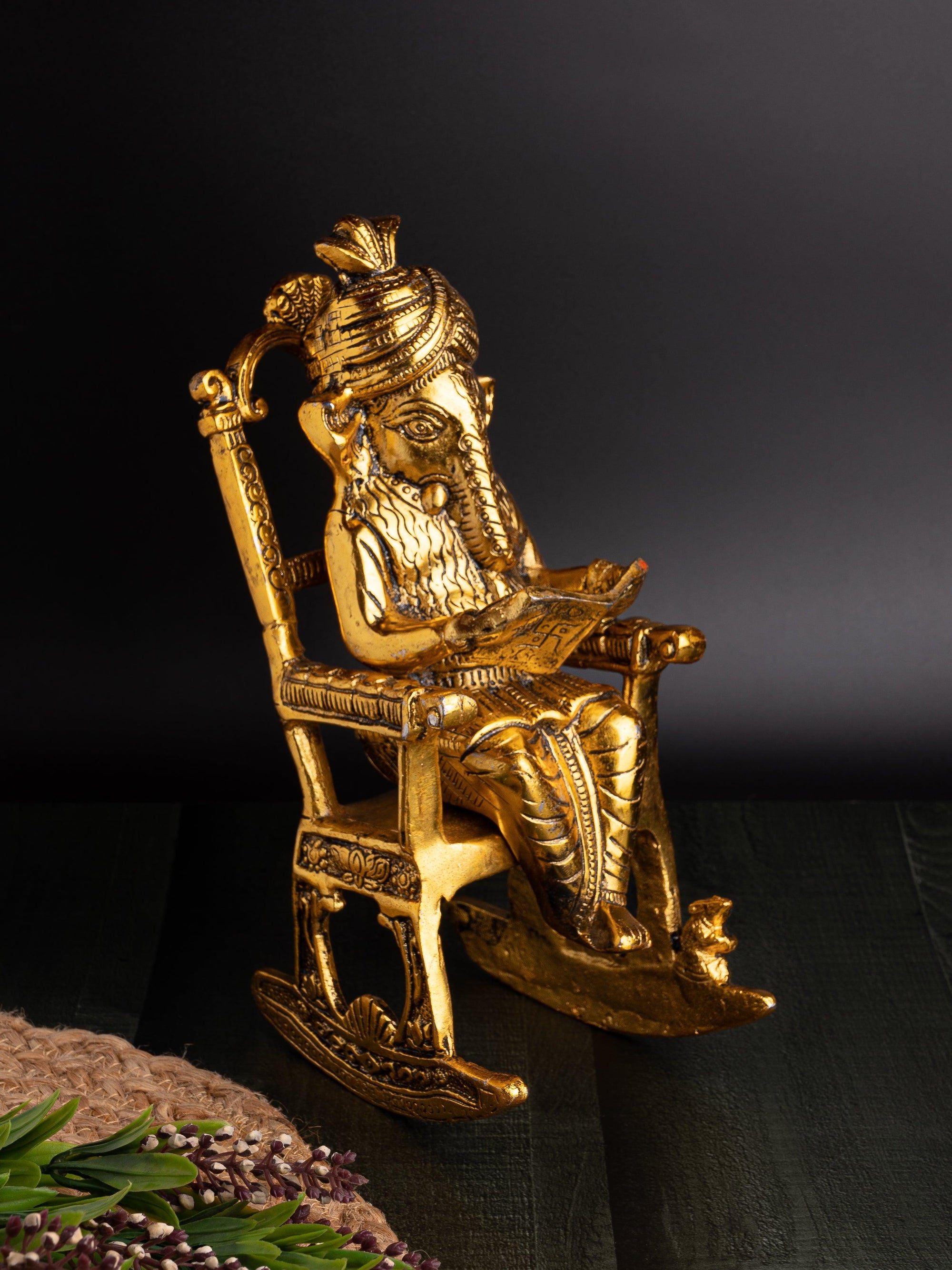 Antique Gold finish Idol of Lord Ganesh reading book on a easy chair - The Heritage Artifacts