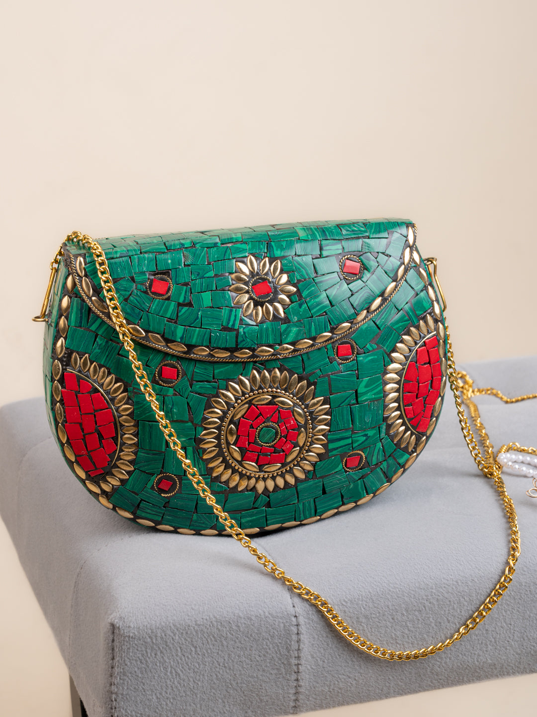 Red and Green stone with brass crafted floral design clutch