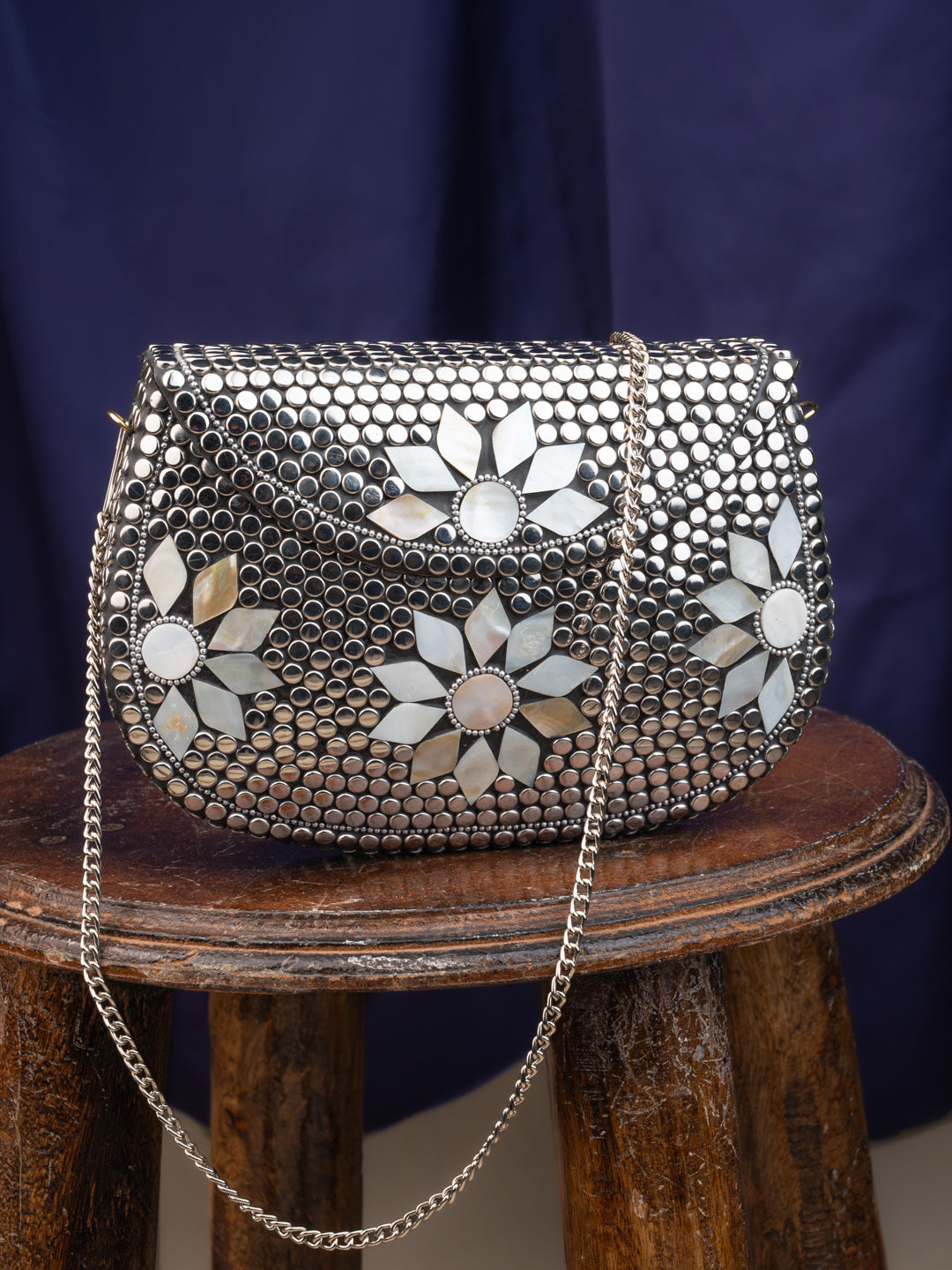 Stainless steel and MOP crafted floral design metal clutch