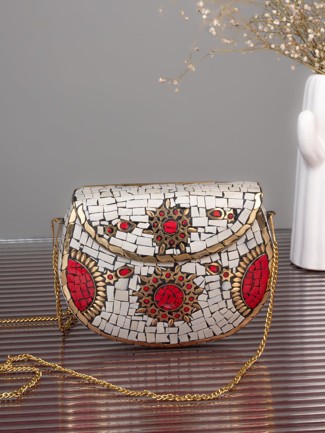 Brass crafted white and red stone embellished mosaic design clutch