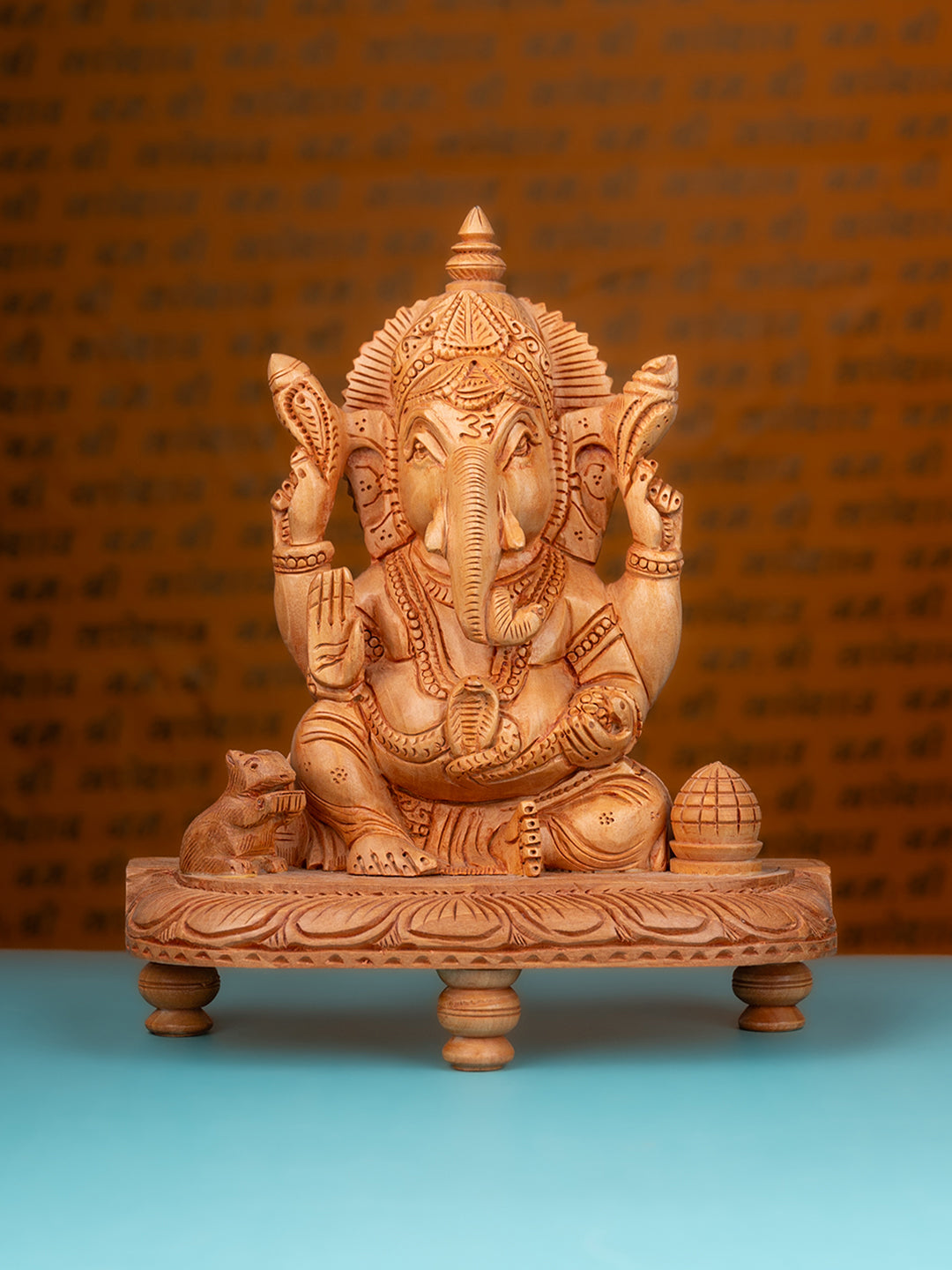 Kadam wood carved ganeshji sitting in a chowki - 10 inches