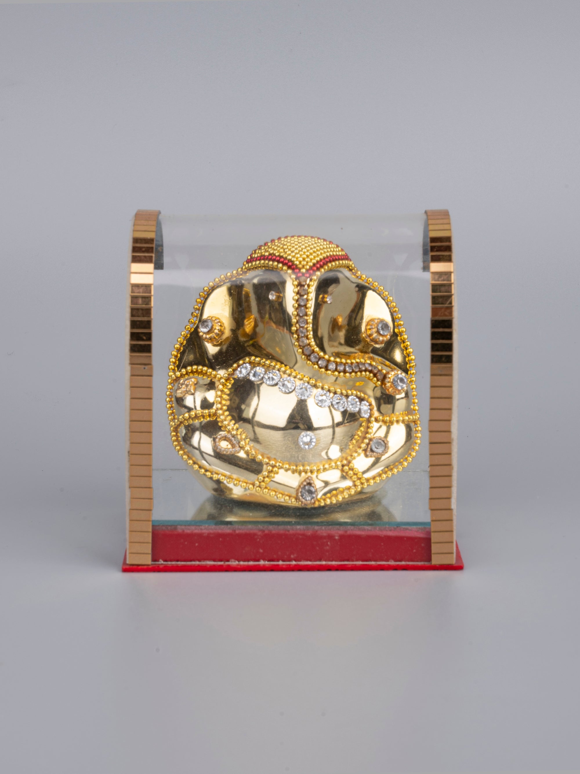 Small Sitting Ganesh Statue in Golden color inside an Acrylic Box - The Heritage Artifacts