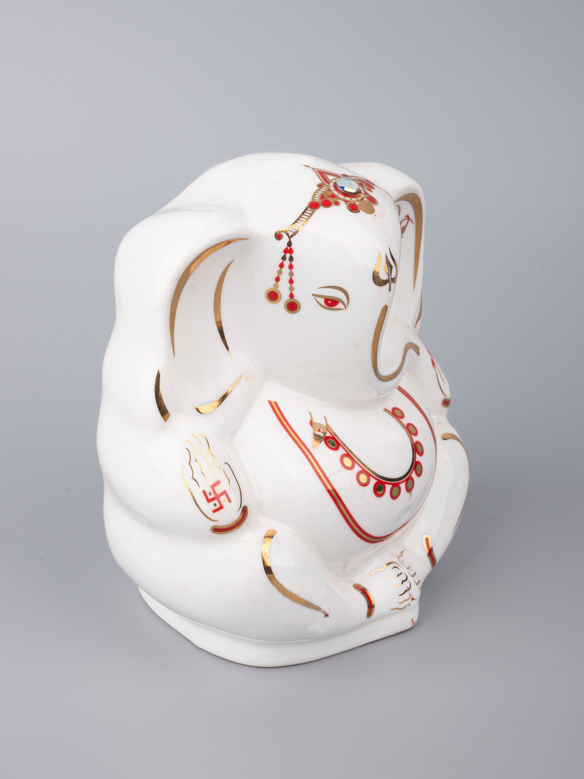White Ceramic Ganesh Idol with Red Decorations - The Heritage Artifacts