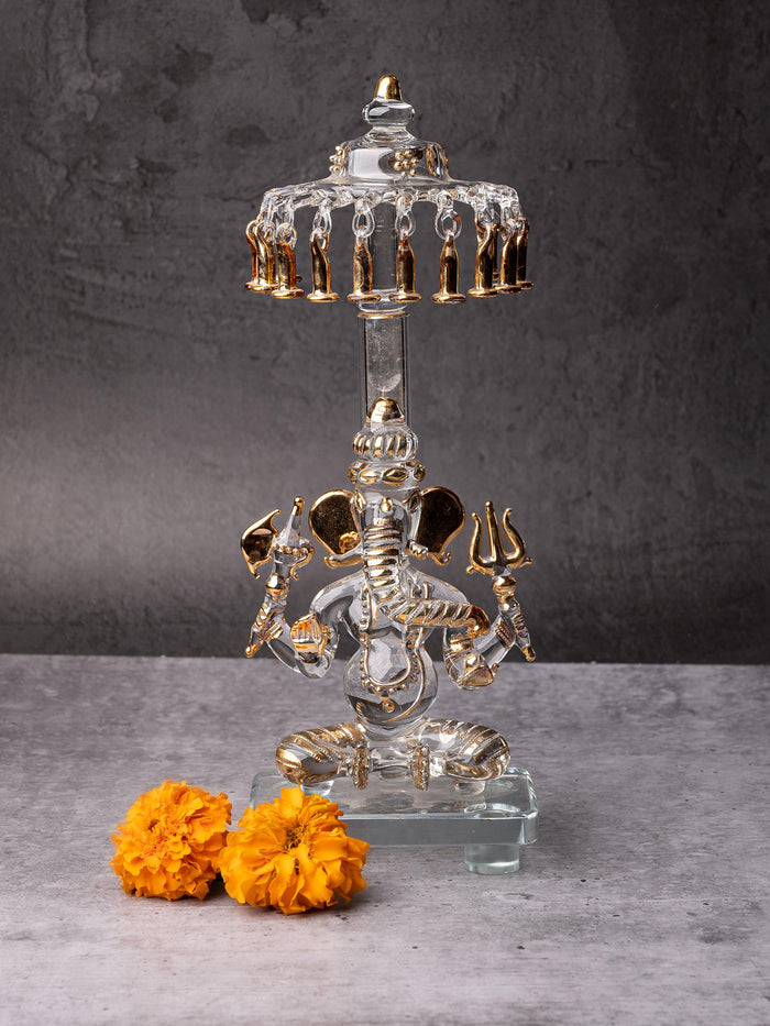 Glass statue of Lord Ganesh sitting below Umbrella - 10 inches height with Gold plating - The Heritage Artifacts